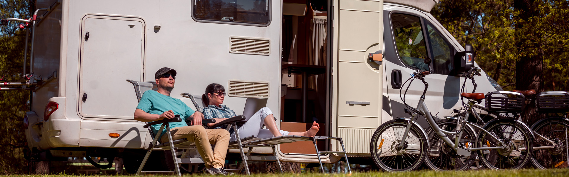 Couple relaxing by their RV